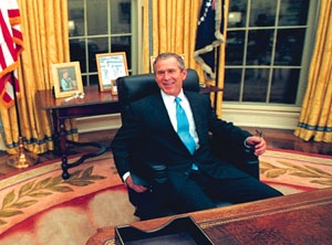 George W. Bush looks around his new office.